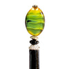 A close up of our Kaja Hair Stick made from green swirl Czech glass beads