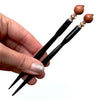 Two of our Kennedy Hair Stick made from copper-colored goldstone.