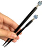 The standard and large sizes of the Kya Tidal Hair Stick made from blue luster Kyanite stones.