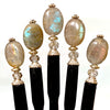 Five A close up of the Malia Tidal Hair Stick made from gray Labradorite stone beads.