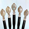 Five A close up of the Malia Tidal Hair Stick made from gray Labradorite stone beads.