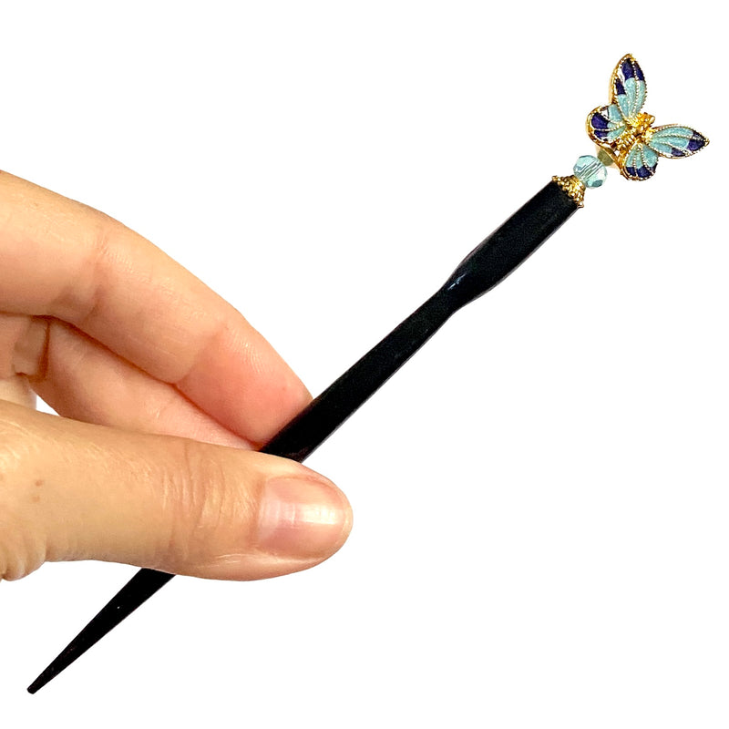 A close up  of the Mariposa Hair Sticks made from cloisonne butterfly beads