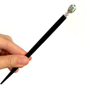 The large size of the Marley Tidal Hair Stick made from iridescent blue glass beads.