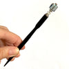 A full shot of the Marley Tidal Hair Stick made from iridescent blue glass beads.