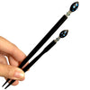 The standard and large sizes of the Melanie Tidal Hair Stick made from black Czech glass beads.