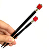 The standard and large size of the Nela Tidal Hair Stick made from a red Czech glass bead.