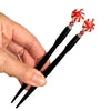 A set of two of our Noelle Hair Sticks made from glass beads that look like peppermint candies.