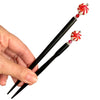 The standard and large sizes of our Noelle Hair Stick made from a glass bead that looks like peppermint candy.