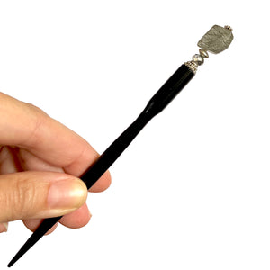 A full picture of our Palmer Hair Stick made from black rutile quartz stone.