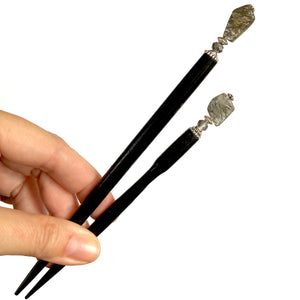 The standard and large sizes of our Palmer Hair Stick made from black rutile quartz stone.