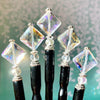 Five of the Penelope Tidal Hair Sticks made from iridescent clear glass beads.