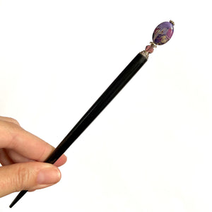The large size of the Petra Tidal Hair Stick made with purple jasper stone beads.