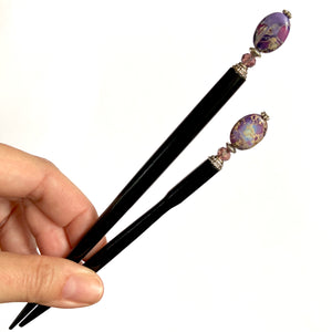 The standard and large sizes of the Petra Tidal Hair Stick made with purple jasper stone beads.