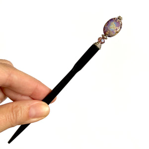 A full view of the Petra Tidal Hair Stick made with purple jasper stone beads.