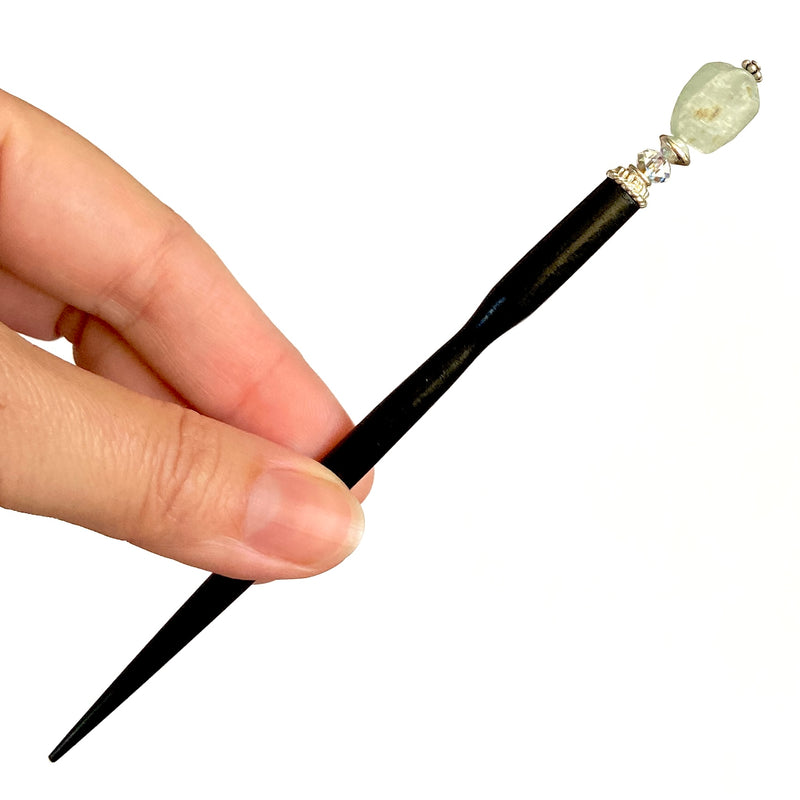 A close up of our Peyton Tidal hair Stick made from green Kyanite stone