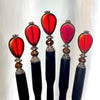A set of five of our Reina Hair Stick made from a red Czech glass bead with bronze edging.