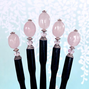 A set of five of our Riley Hair Sticks made from rose quartz stone.