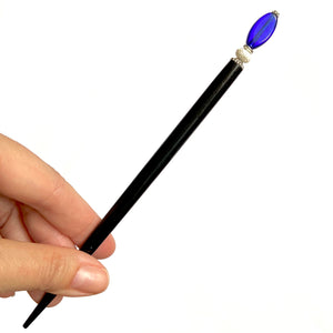 The large size of the Stella Tidal Hair Stick made from cobalt blue glass beads.