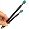 The standard and large sizes of the Zara Hair Stick made from teal blue and red swirl Czech glass beads.