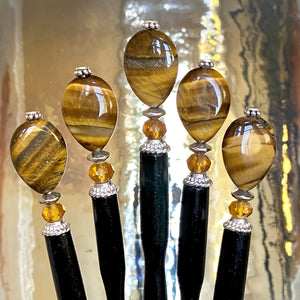 Five of our Nisha hair stick made from Tiger's Eye stone.