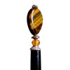 A side view of our Nisha hair stick made from Tiger's Eye stone.