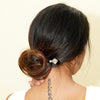 A brunette woman wears a Herkimer Diamond Natasha Tidal Hair Stick in her hair bun