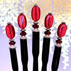 Five of our Madelaine Hair Sticks made from bright red Czech glass beads.