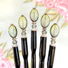 Five of our Brooke Hair Sticks made from green -blue ombre Czech glass beads.