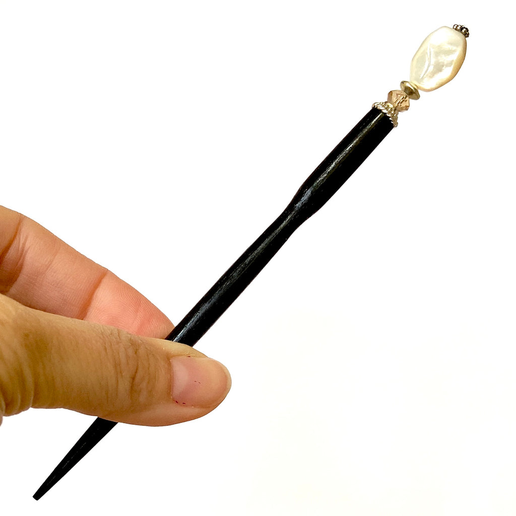 A full shot of the standard size of our Bette Hair Stick made from mother of pearl nuggets