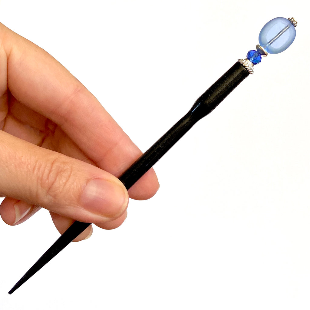 A full shot of our Sydney Hair Stick made from sapphire blue Czech glass beads.