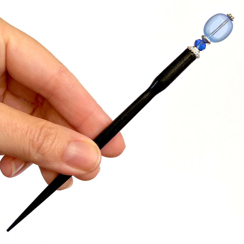 A close up of our Sydney Hair Stick made from sapphire blue Czech glass beads.