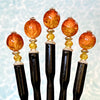 Five of our Maya Hair Sticks made with orange-yellow crackle Czech glass beads.