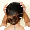 A brunette woman wears a Herkimer Diamond Natasha Tidal Hair Stick in her hair bun. 