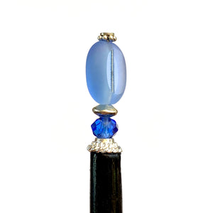 A side view of our Sydney Hair Stick made from sapphire blue Czech glass beads.