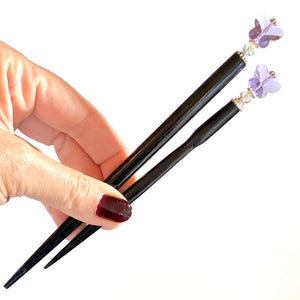The large and standard options of our purple Iris hair sticks