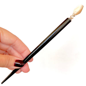 The large size of our Bette Hair Stick made from mother of pearl nuggets
