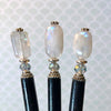 Three of the Luna Tidal Hair Sticks made from Rainbow Moonstone nugget beads.